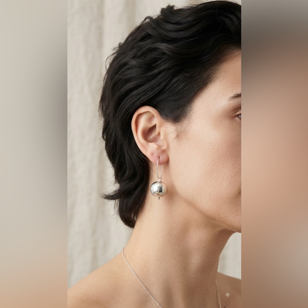 Costume silver pendant ball earrings